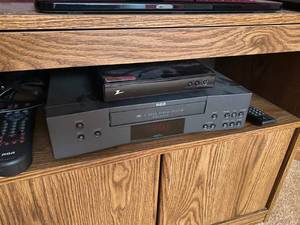 lot 81 image: TV with VHS system, Conversion Box, Remotes and Stand