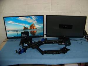 lot 81 image: (2) 27 LG Computer  PC Monitors on Stands with Dual Arm Desk Mount