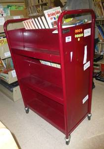 lot 205 image: Luxor rolling double sided book shelf and contents