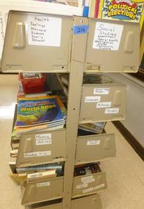 lot 215 image: Shelving unit and books - Social studies, govt, events, states, indians, atlas, World Wars