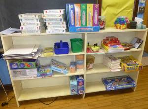 lot 304 image: Shelving unit and contents - phonics, synonym, analogy