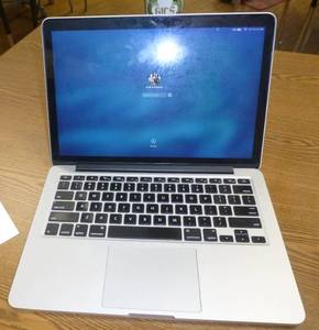 lot 323 image: MacBook Pro - working