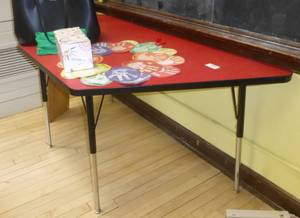 lot 404 image: One piece Red table - half of a hexagon, adjustable legs