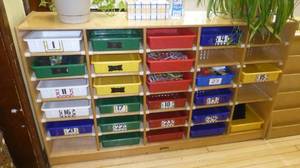 lot 410 image: Large cubby storage cabinet (60x14x35) and contents