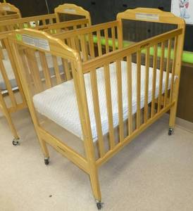 lot 701 image: Baby Crib on wheels with plexiglass ends for easy monitoring