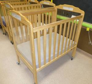 lot 703 image: Baby Crib on wheels with plexiglass ends for easy monitoring