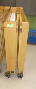 lot 707 image: Folding Baby Crib on wheels with plexiglass ends for easy monitoring