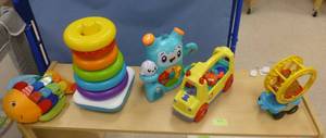 lot 715 image: Group of toys on top of the bookcase