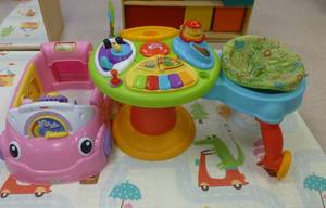 lot 718 image: Pink car and scoot around play station