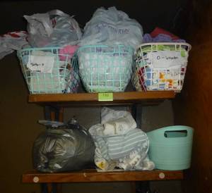 lot 730 image: closet of spare baby clothes