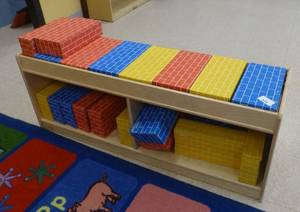 lot 804 image: Mirror bookcase full of foam bricks