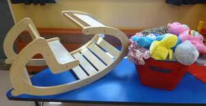 lot 824 image: kids rocker and bin of stuffed toys