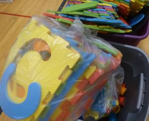 lot G36 image: Two totes full of foam interlocking pads