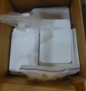 lot G42 image: Plastic interlocking squares and box of new small whiteboards