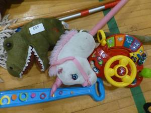lot G55 image: Stick horses, popper, mop and musical toy
