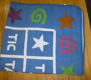lot G67 image: Tote full of misc toys and Tic Tac Toe rug