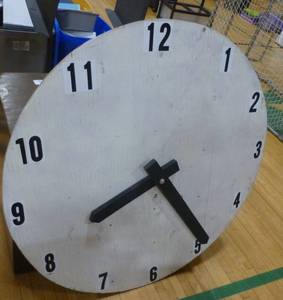 lot G76 image: Small bookshelf and large clock face (probably a stage prop)