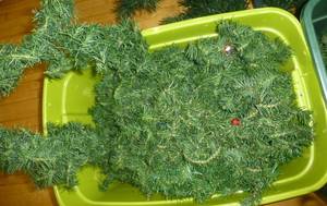 lot G86 image: 2 christmas trees, tote of wreaths and tote of greenery