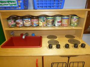 lot C15 image: Wood refrigerator, plastic food, wood stoveovenmicrowave