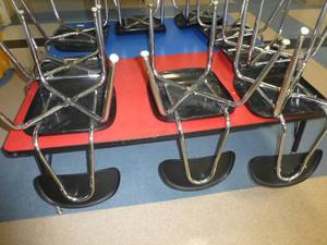 lot C37 image: One red and one blue rectangle tables and 8 chairs