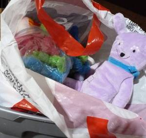 lot E35 image: tote of misc small prizes