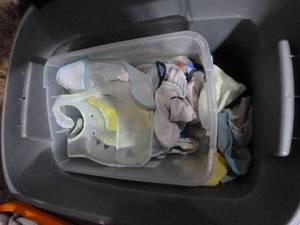 lot E42 image: Tote full of bibs, blankets, wash cloths