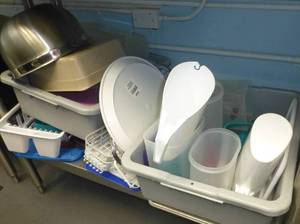 lot K3 image: Silverware (more being washed), tubs with pitchers