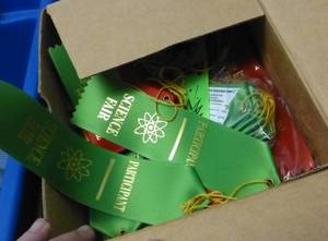 lot O8 image: 2 totes full of stuff - ribbons, box of crayons, display stands