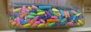 lot O30 image: Tub full of pencil erasers, box full of chalk, pencils, velcro, pens