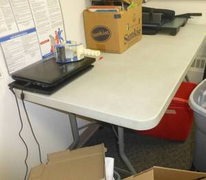 lot O42 image: 6ft Folding table and chair no contents