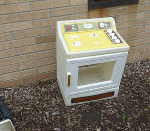 lot P10 image: pile of toy trucks and Little Tikes Stove oven