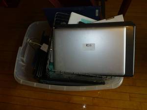 lot R16 image: Pile of laptops and tablets for repair