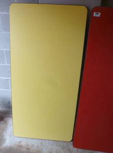 lot S13 image: One red and one yellow table (disassembled) but does come with legs