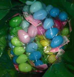 lot G91 image: Two lawn and garden bags full of all new easter egg packs