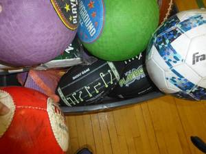 lot G99 image: Tote of balls and a new Rawlings baseball base