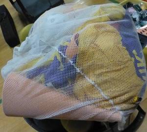 lot G101 image: waste basket full of tee ball bats and stand and bag