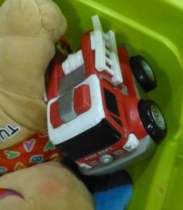lot G121 image: tote of toys and activity cube