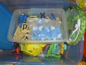 lot G141 image: Tote of letters, activity box, pirate ship, bunch of pencil bags