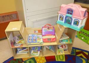 lot 801 image: Seating bookshelf with all books and toys