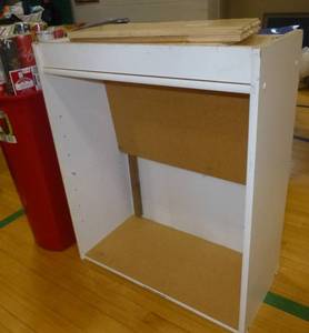 lot G23 image: storage cabinet and christmas wrapping paper