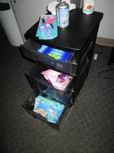 lot O161 image: Plastic organizer on wheels filled with feminine supplies