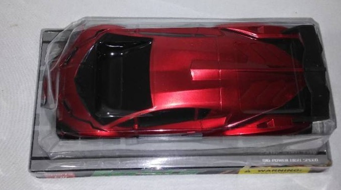lot 737 image: Red Sports car toy.