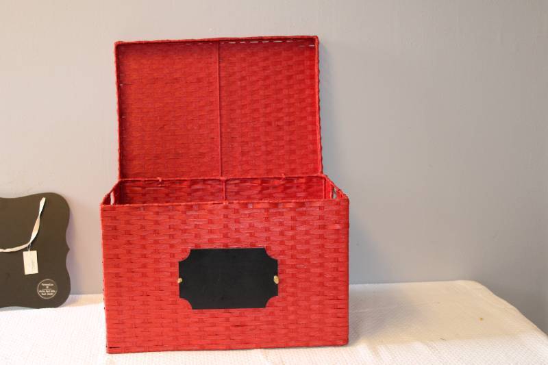 Red wicker basket, and chalkboard sign