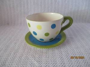 lot 42 image: Polka Dotted Ceramic Teacup with Matching Saucer