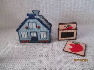 lot 63 image: Handcrafted Plastic Canvas House and Apple-Themed Containers