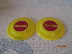 lot 172 image: Vintage Mr. PiBB Yellow Frisbees - Set of 2