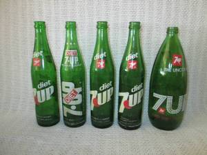 lot 309 image: 4 Diet 7 Up bottles and 1 regular 7 Up bottle