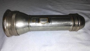 lot 612 image: Burgess Metal Flashlight.