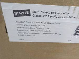 lot 92 image: Staples 26.5 Deep 2 Drawer Metal File Cabinet- has some repairs needed as shown