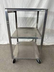 lot 33 image: MSRP $600 Chattanooga MB-T Stainless Steel Mobile Stand Cart Tall -&nbspdesigned to be used to transport stationary heating, ultrasound, or electrotherapy units 30 x 19 x 17 - In Good Condition
